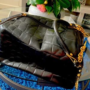 In great condition Carmen Steffens Black lather Trunk .